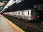 R-44 5228 @ Rockaway Park (A / S). This car has a stainless steel band replacing the usually painted carbon steel band. Photo ta